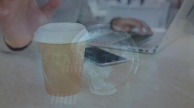 Animation of cyber security data processing and globe over mid section of man using laptop at a cafe. Global networking and business technology concept