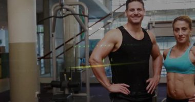 Animation of data processing over caucasian sports people at gym. Global sport and digital interface concept digitally generated video.