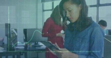 Animation of financial data processing over caucasian businesswoman using tablet in office. Global networks, computing, business, finance and data processing concept digitally generated video.