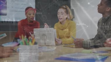 Animation of connected icons, graph icons over multiracial coworkers discussing report in office. Digital composite, multiple exposure, report, finance, teamwork, communication and technology.