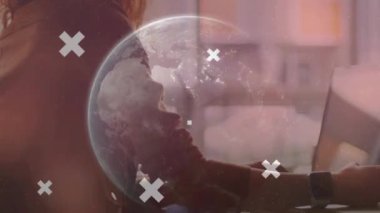 Animation of data processing and globe over hands using laptop. Global business and digital interface concept digitally generated video.
