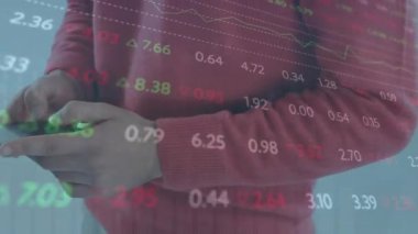 Animation of financial data processing over caucasian man using smartphone. Global technology, finances and digital interface concept, digitally generated video.