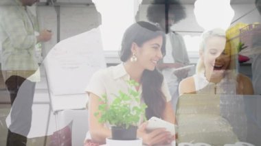 Animation of business people over cityscape. Global business, computing, connections and data processing concept digitally generated video.