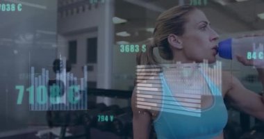 Animation of data processing over caucasian woman at gym drinking water. Global sport and digital interface concept digitally generated video.