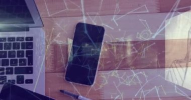 Animation of network of connections over smartphone and laptop. Global computing, business, finance and data processing concept digitally generated video.