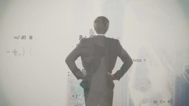Animation of data processing and businessman over cityscape. Global business, finances, computing and data processing concept digitally generated video.