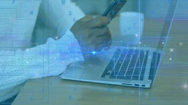 Animation of financial data processing over biracial binary coding over biracial numbers using laptop. Global business finances connections and digital interface concept digitally generated video.