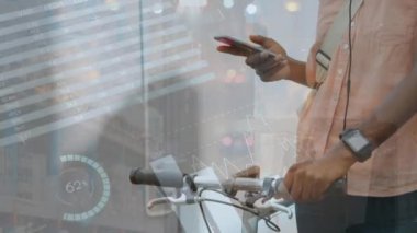Animation of statistical data processing over mid section of a man with bicycle using smartphone. Business data technology concept