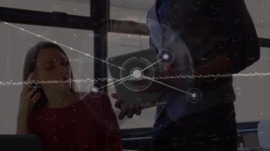 Animation of network of connections over diverse business people discussing in office. Global business, finance, computing and data processing concept digitally generated video.