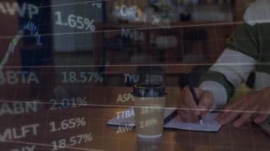 Animation of financial data processing over over mid section of a man taking notes. Global finance and business technology concept