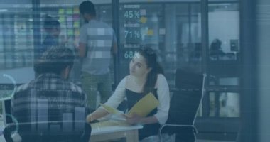 Animation of infographic interface over diverse woman explaining reports to coworkers in office. Digital composite, multiple exposure, global, teamwork, abstract, discussion and business concept.