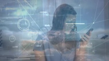 Animation of network of connections and data processing over caucasian woman using smartphone. Global technology, connections and digital interface concept, digitally generated video.