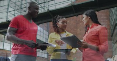 Animation of financial data processing over diverse business people. Global business, finance, computing and data processing concept digitally generated video.