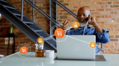 Animation of network of connection over african american businessman using smartphone and laptop. Global business, computing, connections and data processing concept digitally generated video.