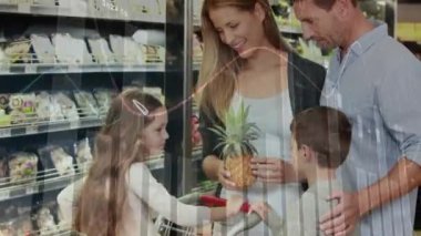 Animation of financial data processing over caucasian family at supermarket. Global lifestyle, finances and digital interface concept, digitally generated video.