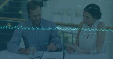 Animation of financial data processing and statistics over business people. Global business, finance, data processing and connections concept digitally generated video.
