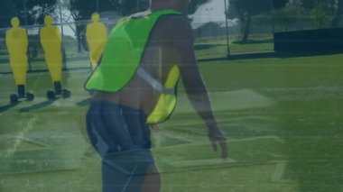 Animation of financial data processing over football players. Global sports, finance, computing, connections and data processing concept digitally generated video.