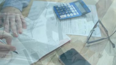 Animation of financial data processing over man writing. Global finance, business and data processing concept digitally generated video.