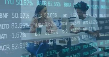 Animation of data processing over diverse business people eating and talking in office. Global business and digital interface concept digitally generated video.