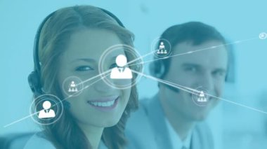 Animation of network of connections with icons over diverse business people using phone headsets. Global business, finance, computing and data processing concept digitally generated video.