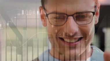 Animation of statistical data processing over caucasian man wearing glasses using smartphone. Global networking and business data technology concept