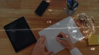 Animation of financial data processing and globe over man writing. Global finance, business and data processing concept digitally generated video.