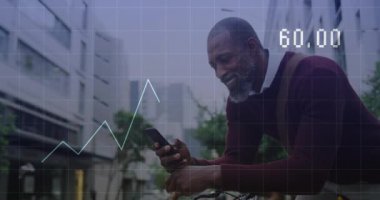 Animation of financial data processing over african american man using smartphone. Global business, finance, computing and data processing concept digitally generated video.