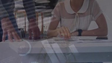 Animation of statistics and financial data processing over business people. Global business, finances, computing, networks and data processing concept digitally generated video.