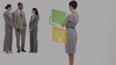Animation of media icons over diverse business people talking. Global business and digital interface concept digitally generated video.