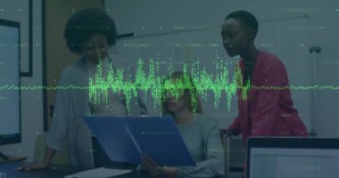 Animation of financial data processing over diverse businesswomen talking in office. Global business, finance, computing and data processing concept digitally generated video.
