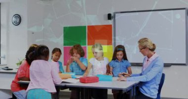 Animation of shapes moving over caucasian female teacher with diverse schoolchildren. Global education and digital interface concept digitally generated video.