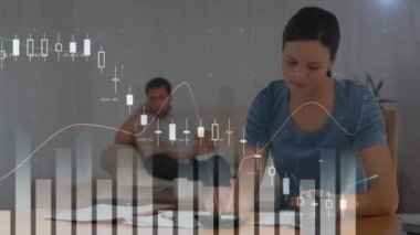 Animation of multiple graphs moving over caucasian woman calculating pending bills at home. Digital composite, multiple exposure, report, home finance, business, expense, debt and banking concept.