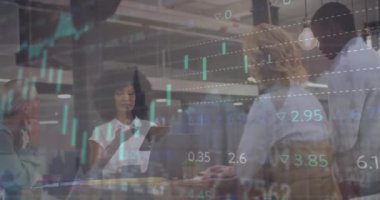 Animation of financial data processing over diverse business people in office. Global networks, computing, business, finance and data processing concept digitally generated video.