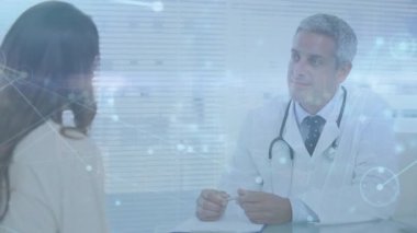 Animation of network of connections over male doctor with female patient. Global medicine, networks, computing and data processing concept digitally generated video.
