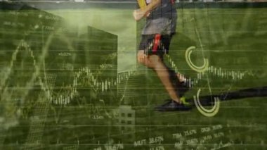 Animation of financial data processing over football player. Global sports, finance, computing, connections and data processing concept digitally generated video.