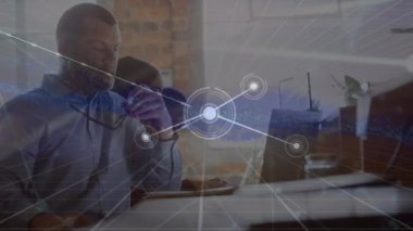Animation of network of connections over diverse business people working in office. Global business, finance, computing and data processing concept digitally generated video.