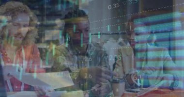 Animation of graphs and loading circles over diverse coworkers examining designs in office. Digital composite, multiple exposure, report, business, discussion, teamwork and technology concept.