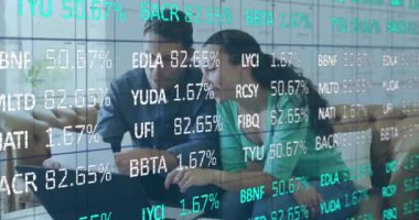 Animation of data processing over caucasian couple using laptop. Global business and digital interface concept digitally generated video.