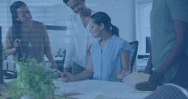 Animation of infographic interface, transmission towers, woman explaining blueprint to coworkers. Digital composite, multiple exposure, report, diverse, office, teamwork, discussion and business.