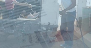 Animation of sale text, hud interface, cropped hand with dollar bill, diverse couple at gas station. Digital composite, multiple exposure, discount, love, currency, togetherness and technology.