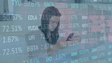 Animation of stock market data processing over woman using smartphone at office. Global economy and business technology concept