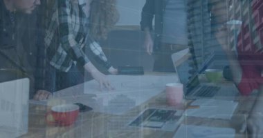 Animation of data processing and cityscape over diverse business people working in office. Global business and digital interface concept digitally generated video.