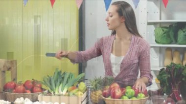 Animation of financial data processing and statistics over woman shopping. Global business, finance, data processing and connections concept digitally generated video.
