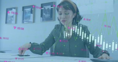 Animation of data processing over biracial businesswoman at office. Global business, finances and digital interface concept, digitally generated video.