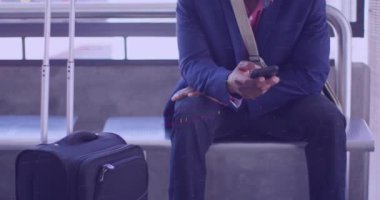 Animation of financial data processing and man in face mask on bus. Covid 19 pandemic, medicine, healthcare, finance, computing and data processing concept digitally generated video.