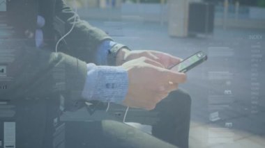 Animation of financial data processing over man using smartphone. Global business, finances, computing and data processing concept digitally generated video.
