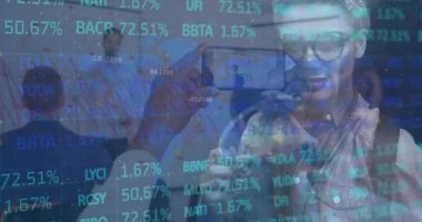 Animation of financial data processing over business people in office. Global business, finance, data processing and computing concept digitally generated video.