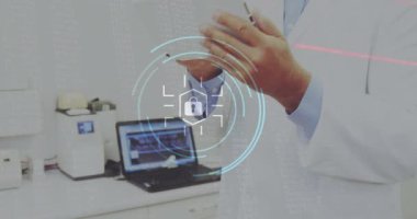Animation of security padlock icon over caucasian senior male doctor using digital tablet. Cyber security and medical healthcare technology concept