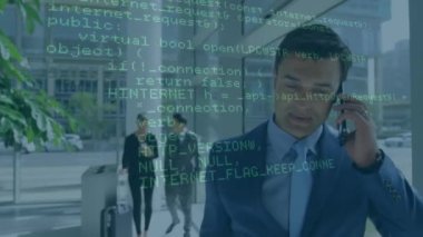 Animation of financial data processing over businessman using smartphone. Global networks, computing, business, finance and data processing concept digitally generated video.