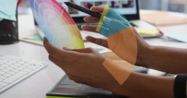 Animation of diagram icon over caucasian businesswoman using tablet in office. Global business and digital interface concept digitally generated video.